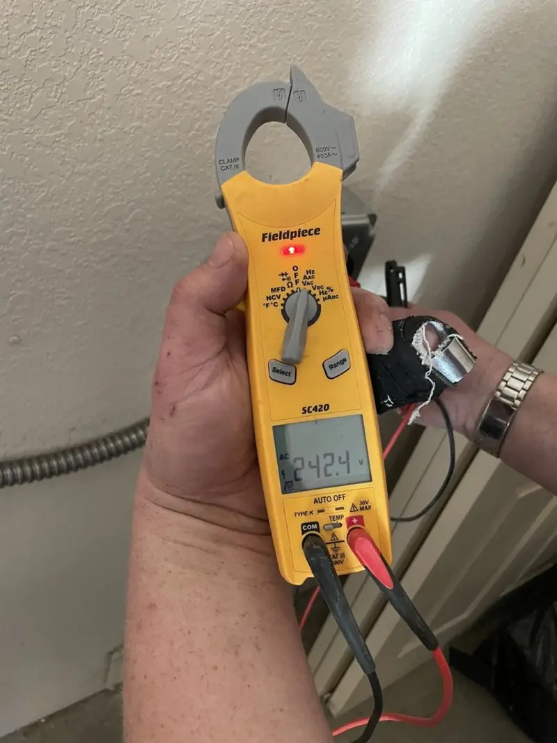 Voltage testing with clamp meter during Ceiling Fan Installation in Bart